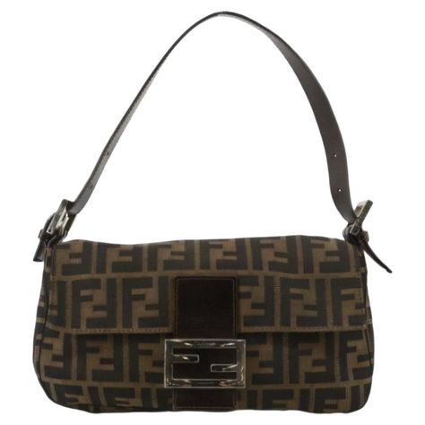 Fendi Baguette Classic Zucca Print Fendi Monogram These are professional photos of the actual bag offered by Luxbags. Introducing the Fendi Baguette, a classic icon featuring the beloved Zucca print. This vintage brown shoulder bag is a must-have for fashion lovers, bringing both style and functionality. Carry your essentials in the epitome of timeless elegance. Model: Fendi Baguette;Size: Medium;Condition: Very good vintage condition;Exterior Material: Canvas;Exterior Color: Brown;Strap Material: Leather;Strap Color: Brown;Hardware Color: Silver;Lining Material: Nylon;Lining Color: Brown Baguette Bag Fendi, Fendi Baguette Vintage, Fendi Vintage Bag, Vintage Fendi Baguette, Fendi Zucca Baguette, Chloe 2024, Fendi Monogram, Fendi Baguette Bag, Classic Icon