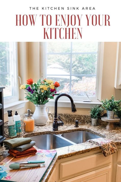 Enjoy your kitchen again with these tips for decorating and organizing your kitchen sink area.    The Scarlet Lily Blog  Fashion, Beauty, Home Decor  #KitchenDecor #KitchenSinkOrganization #KitchenOrganization #HowToOrganizeYourKitchen #KitchenStyle #FarmhouseStyle #KitchenWork #KitchenDecoratingIdeas #KitchenDecorThemes Decor Above Kitchen Sink With No Window, How To Decorate Behind A Corner Kitchen Sink, Corner Sink Kitchen Decor, Corner Kitchen Sink Ideas, Beadboard Walls, Kitchen Sink Area, Trendy Kitchen Design, Corner Kitchen Sink, Kitchen Sink Decor