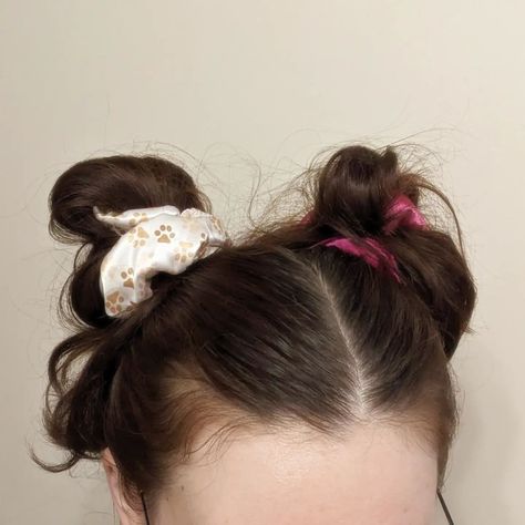 Cute Buns 😍! This hairstyle is not only cute, but also very functional! If you have thick, long hair, then you know how HEAVY a single bun can feel. This hair style really helps to offset the weight of a regular bun, while helping to lock in a hair serum 🫶✨! AND the added bonus of using scrunchies vs. a regular hair tie works wonders! If you want to create even less hair damage when conditioning or using a hair serum, scrunchies are a great way to hold the hair together, without pulling o... Space Buns With Scrunchies, How To Tie A Bun With A Claw Clip, Big Scrunchies Hairstyles, Space Buns Scrunchie, Big Scrunchie Bun, Cute Buns, Hair Serum, Damaged Hair, Hair Ties