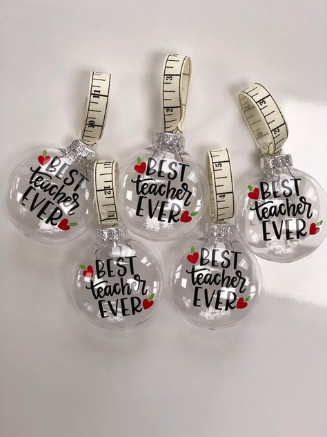 "Best Teacher Ever Christmas Ornament Teacher Ornament Best Teacher Ornament Custom Teacher Ornament Personalized Teacher Ornament * Q U I C K * F A C T S * ✺ This price is for one ornament only ✺ These are 3\" clear plastic ornaments that have \"Best Teacher Ever\" on it ✺ I am able to personalize the back of the ornament with a teacher's name ✺ There is a ruler ribbon at the top so you can hang it on a tree ✺ The font used for the name on the back is shown in the photos section of the listing Diy Teacher Christmas Gifts, Cricut Ornaments, Clear Plastic Ornaments, Clear Christmas Ornaments, School Christmas Party, Appreciation Gifts Diy, Teacher Appreciation Gifts Diy, Teacher Craft, Teacher Ornaments