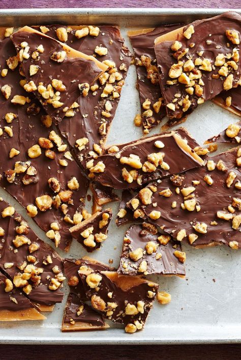 Because of the amount of butter in this candy recipe, the toffee does not stick to the unbuttered foil. You'll need just a handful of ingredients to make this homemade toffee recipe, and once you've mastered the technique, it's easy to customize with your favorite flavors. #homemadetoffee #toffeedessert #howtomaketoffee #dessertrecipeideas #bhg Homemade Toffee Recipe, Toffee Dessert, How To Make Toffee, Homemade Toffee, Candy Stand, Toffee Recipe, Candy Recipe, Foods To Make, Christmas Goodies