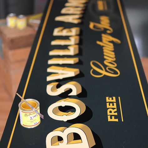 Traditional pub signwriting for the Bosville Arms, Rudston. Black green background with ivory lettering and gold block shade. Gold Leaf Signs, Paul Banks, Sign Painting Lettering, Sign Writer, Gold Leaf Design, Photoshop Design Ideas, Tattoo Signs, Yorkshire Uk, Calligraphy Art Print