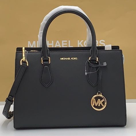 Brand New With Tag Michael Kors Sheila Medium Center Zip Satchel Bag Details Color: Black Satchel Faux Leather 88.92% Coated Canvas/11.08% Polyester Silver-Tone Hardware 11"W X 8"H 3.25"D Handle Drop: 4" Interior Details: Back Zip Pocket, 2 Front Slip Pockets Lining: 100% Polyester Zip Fastening Imported Michael Kors Black Satchel For Travel, Michael Kors Bag Outfit, Black Michael Kors Bag With Top Carry Handle, Classic Black Michael Kors Satchel, Michael Kors Black Satchel For Daily Use, Michael Kors Bag Black, Michael Kors Black Satchel With Gold-tone Hardware, Michael Kors Satchel, Black Satchel