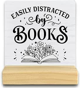 QASHWEY Book Lovers Gifts Desk Decor, Reading Nook Decor Wood Table Signs, Reading Corner Decor Gifts for Book Lover Reader,Easily Distracted by Books Wooden Plaque with Wooden Stand for Home Library Books And Gifts Sign, Book Now Sign, Reading Corner Sign, Signs For Reading Nook, New Book Signs For Library, Nook Decor, Corner Decor, Personal Library, Easily Distracted