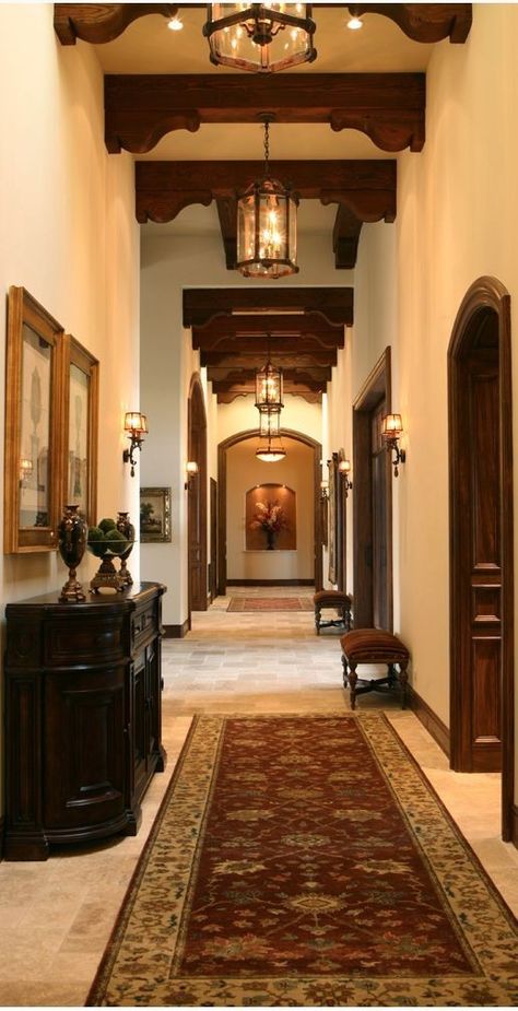 Spanish Hallway Ideas, Backdoor Entrance Ideas, Dark Colonial Interior, Spanish Italian Style Homes Interior, Colonial Doors Interior, Spanish Hacienda Interior, Spanish Hacienda Living Room, Ceiling Corbels, Spanish Home Living Room