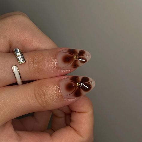 fall set🦦 @roubie_s • • using @apresnailofficial médium sculpted almond • • • • #nailsbyrosane #nails #nailsmtl #nailtech #nailtechmtl #ongles #gelxnails #apresgelx #mtl #ignails #simplenails #frenchtipnails #nailart #nailinspiration #prettynailssalon #evileye #man #manicure #natural #haileybieber #chrome #fallnails #brown #brownnails #fallset #falldesign Brown Flower French Tip Nails, Brown Blooming Nails, Brown Flowers Nails, Brown 3d Flower Nails, Brown Airbrush Nails, Brown Nails With Flowers, Brown Nails With Chrome, Brown Flower Nails, French Nails Brown