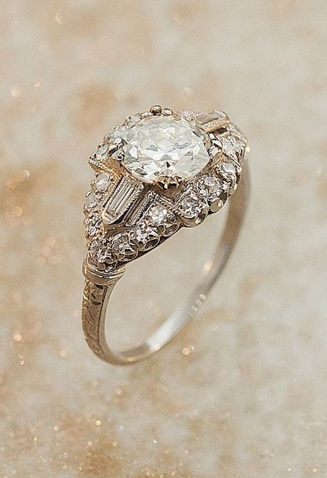 Engagement rings have changed a lot over the years. Take a look back at some of the most popular (and gorgeous) designs of the past century and share your favorite! Bijoux Art Deco, Bijoux Art Nouveau, Edwardian Ring, Mother Art, Antique Engagement Ring, Art Deco Diamond Rings, Vintage Diamond Rings, Antique Engagement, Antique Engagement Rings