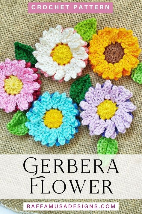 crochet gerbera flower appliques made in yarn of different colors Fidget Sleeves, Crochet Gerbera, Jar Covers, Gerbera Flower, Crochet Wreath, Crochet Flowers Easy, Crochet Flowers Free Pattern, Crochet Coaster Pattern, Crocheted Flowers