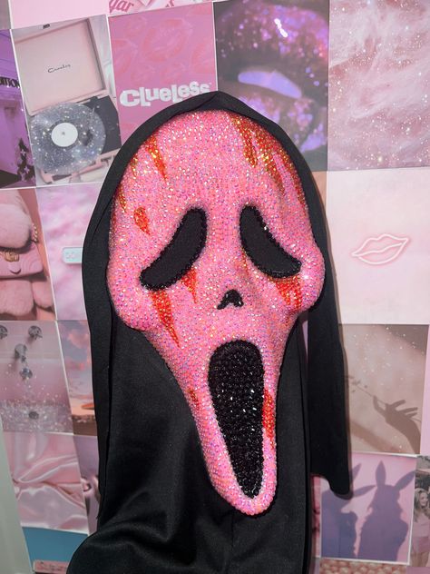 Product listed: Miss Ghostface | Scream | Scream Mask | Halloween | Halloween ideas | Halloween costumes | Halloween rhinestone | Scream Rhinestone Mask  This mask is a handmade replica of the original Ghostface, except very intricately bedazzled all over with pink, red, and black rhinestones. It comes with the light up battery inside the mouth on the inside of the mask. Knife sold separately.  Shipping: If you would like your product before any of the allotted times, there are other options for expedited shipping at checkout. Make sure to take a look, or feel free to contact us. We will do our best to make anything happen!  Policies: Please refer to the Shop Policies section of our shop, or feel free to reach out to us with any questions regarding our Shop Policies!  If you have any other Cute Halloween Makeup With Glasses, Pink Ghost Face Mask, Pink Ghostface Mask, Pink Scream Costume, Cute Scream Costume, Pink Ghostface Costume, Bedazzled Ghostface Mask, Pink Scream Mask, Bedazzled Scream Mask