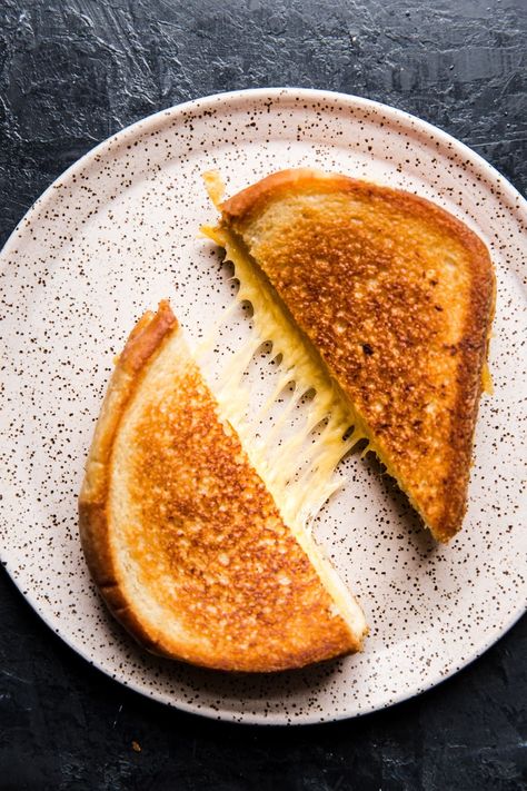 Melted cheese between two pieces of toasted golden bread. We’ve fine-tuned a classic and the result is the perfect grilled cheese sandwich. The Perfect Grilled Cheese, Roasted Rhubarb, Perfect Grilled Cheese, Grilled Ham And Cheese, The Modern Proper, Modern Proper, Making Grilled Cheese, Classic Grilled Cheese, Delicious Vegetarian Recipes