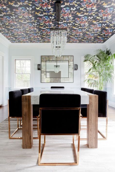 Dining room with wallpapered ceiling Wallpaper On Ceiling In Dining Room, Walnut Wallpaper, Wallpapered Ceiling, Dark Butterfly, Black Chairs, Wallpaper Ceiling, Slab Table, Room Ceiling, The Dining Room