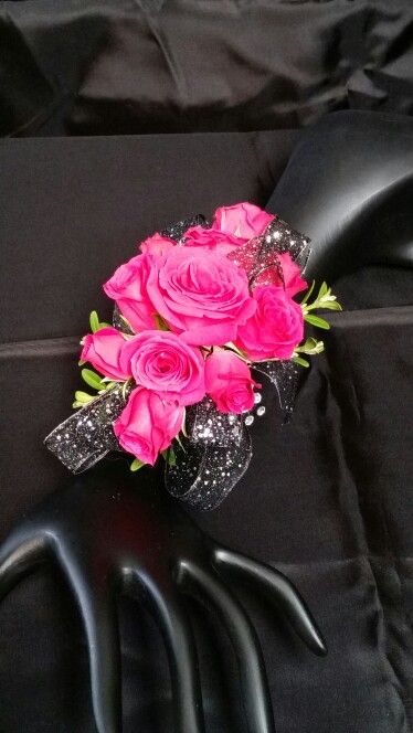 Wrist corsage of hot pink spray roses Black Dress With Hot Pink Accessories, Hot Pink Corsage Prom Wristlets, Corsage Pink And Black, Hot Pink Flower Corsage, Hot Pink Rose Corsage, Hot Pink And Black Corsage Prom, Corsage Prom Hot Pink, Hot Pink Corsage And Boutonniere Prom, Pink Corsage Homecoming