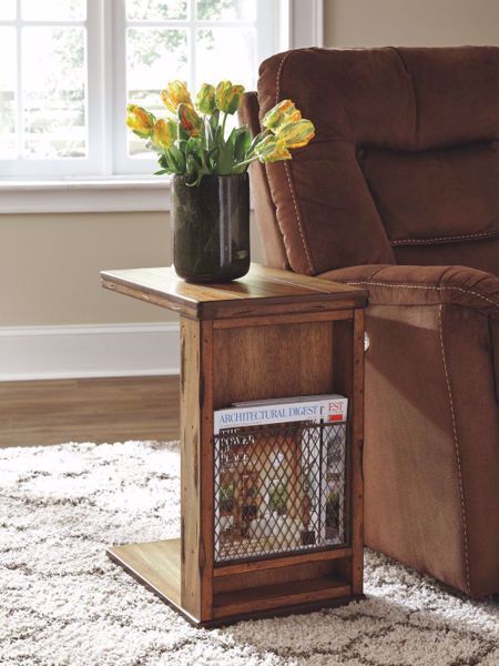 Chiseled distressing, a thick breadboard top and a rustic finish over rich mango veneers lend this chairside end table an earthy, farmhouse feel. Metal mesh grill provides a handy spot to tuck away everything from tablets to crossword puzzles. Clever cantilever design allows you to slide the tabletop right over your sofa seat for a convenient flat surface. Ashley Home, Brown Chair, C Table, Sofa End Tables, Ashley Furniture Homestore, End Tables With Storage, Coffee Table Accents, Decor Display, Ashley Furniture