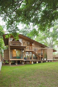 A Bamboo House Embraced by Nature Big Wooden House, Bamboo Houses, Bamboo Building, Hut House, Modern Tropical House, Tropical Lifestyle, Tropical House Design, Bamboo House Design, Bahay Kubo