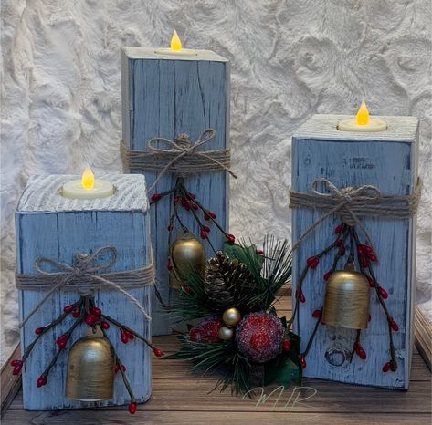 This adorable set of Christmas tea light candle holders will make a great addition to your Christmas decor! These candle holders look great as a centerpiece on the dining table, on the mantel, shelf or just about anywhere you put them!  These candle holders are handmade and distressed so no two sets are exactly alike.  They come already decorated with a gold Christmas Bell, twine and berries. The blocks are approximately 6, 8, and 10 inches high and 3 1/2 inches wide.  PLEASE KEEP IN MIND EACH C Christmas Wood Candle Holders, Wood Block Crafts Christmas, Wooden Block Crafts, 4x4 Candle Holders, Reclaimed Wood Christmas Decor, Diy Jenga Blocks Ideas, Large Wood Candle Holders, 4x4 Crafts, 4x4 Wood Crafts