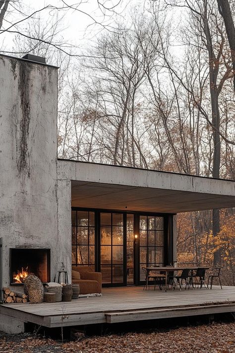 Modern house with precast conrete facade built on an old factory with preserved chimney porch with cozy furniture leafless trees in the background in late autumn. Check out how precast concrete facades can transform your house with sleek design, incredible durability, and eco-friendly benefits. Concrete Wall House, Industrial Look House, Prefab Concrete Homes, Precast House Design, Brutalist Home Exterior, Concrete Contemporary House, Cement Interior Design, One Floor House Design Modern, Brutalism House