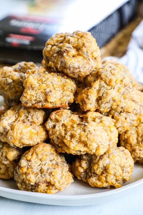 Discover the joy of simplicity and flavor with these easy Red Lobster Cheddar Bay Biscuit Sausage Balls—your go-to for the best sausage ball recipe that's perfect for breakfast, brunch, or a holiday appetizer. Featuring a delightful blend of breakfast sausage and sharp cheddar, these easy sausage balls are a crowd-pleasing sensation. Effortless to make ahead and freezer-friendly, elevate your snack game with these bites that promise to steal the show at any gathering. Biscuit Sausage Balls, Cheddar Bay Sausage Balls, Best Sausage Ball Recipe, Easy Sausage Balls, Easy Sausage Balls Recipes, Sausage Ball, Red Lobster Cheddar Bay Biscuits, Red Lobster Biscuits, Sausage Balls Recipe