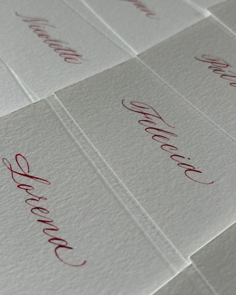 Calligraphy place cards with red ink on white paper Love Calligraphy, Calligraphy Place Cards, Calligraphy I, Calligraphy Handwriting, Cursive Writing, Red Ink, Wedding Place Cards, Modern Calligraphy, Name Cards