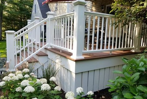 Flat Roof With Railing, Skirting House Exterior, Front Porch Horizontal Railing Ideas, Board And Batten Deck Skirting, Deck On Brick House, Side Deck Ideas, Cottage Deck Ideas, Porch Underpinning, Small Front Deck