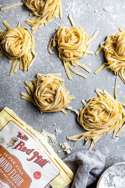 This homemade gluten-free almond flour pasta is a perfect neutral pasta to top with your favorite sauce. Tender eggy noodles with a silken texture and an ever-so-slightly sweet flavor notes. #almondflour #glutenfree #pasta #homemadepasta #recipe #foodblog #Italian #freshpasta #tapiocastarch #sweetriceflour #noodles