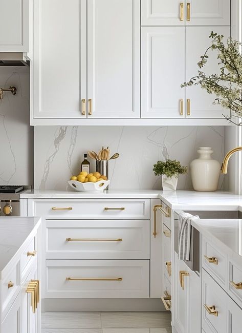 Kitchen White And Gold Interior Design, Golden Hardware Kitchen, White And Gold Kitchen Cabinets, White Kitchen Gold Handles, White Cabinets Gold Hardware Kitchen, White And Bronze Kitchen, White Kitchen Gold Hardware, White Cabinets In Kitchen, White Kitchen With Gold Hardware