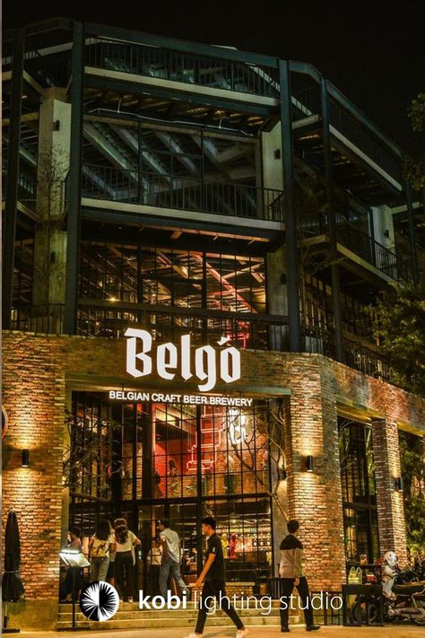 This PIN shows the design of Belgo Belgian Craft Beer created by kobi lighting studio.For the exterior, we had several challenges such as creating an interior courtyard with an intimate, comfortable atmosphere while still being open to the street. We also had to design lighting for the façade that would highlight the location sufficiently without creating light pollution. 

#kobiproject #lightingconcept #kobi #lightingdesigners #lightingdesign #lightingconsultant #belgo #beer #belgium #hochiminh Industrial Beer Garden, Bar Facade Design, Restaurants Exterior, Brasserie Design, Pub Exterior, Brewery Interior Design, Brewery Interior, Beer Restaurant, Industrial Facade