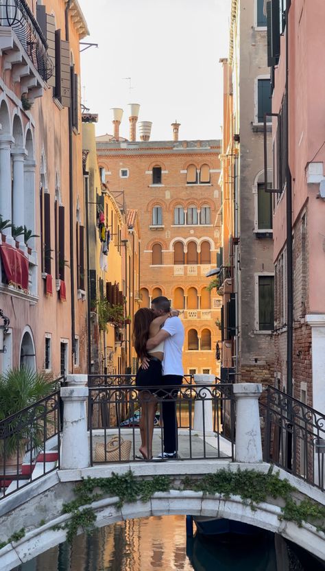 A couple hugging on a bridge in Venice Italy Italian Relationship Aesthetic, Couple Vacation Pictures Italy, Venice Italy Honeymoon, Italy Travel Aesthetic Couple, Italy Travel Couple, Traveling With Partner Aesthetic, Venice Couple Aesthetic, Travel With Partner Aesthetic, Italian Summer Love