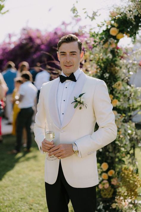 Wedding attire 16 ideas for men in 2024 White Men Suit Wedding, Wedding Groom Suit White, Classic Tuxedo Wedding, Ivory Suits For Men Wedding Tuxedos, White Wedding Outfit Men, Luxury Spring Wedding Tuxedo, Mens Wedding Attire Black, White Suit For Men Wedding, Tuxedo For Wedding