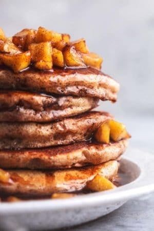 stack of apple cinnamon pancakes with apple topping and syrup Vegan Apple Cider, Apple Cider Pancakes, Applesauce Pancakes, Cranberry Walnut Salad, Apple Cinnamon Pancakes, Cinnamon Pancakes, Apple Pancakes, Vegan Apple, Walnut Salad