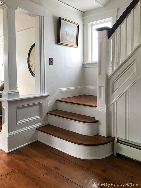 Fancy trim makes all the difference on a Colonial Farmhouse Staircase. Dark Trim Staircase, White Craftsman Staircase, European Farmhouse Staircase, Front Entryway Ideas With Stairs, English Staircase, Old House Staircase, Colonial Stairs, Colonial Farmhouse Interior, Colonial Farmhouse Interior Design