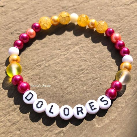 Selena’s Jewelz on Instagram: “Encanto Themed Bracelet 👂 Message me for more info! #DisneyBracelet #Disney #DisneyLand #Disneymom #Encanto #EncantoBracelet #Mirabel…” Encanto Crafts, Bracelet Message, Disney Bracelet, Disney Mom, Letter Bracelet, Bracelet Ideas, Pusheen, Pastel Aesthetic, Message Me