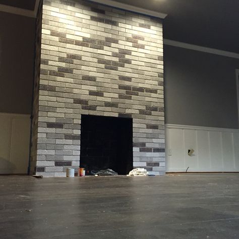 My after fireplace project. Painted each brick with leftover wall/ceiling paint… Modern Brick Fireplace, Fireplace Redo, Painted Brick Fireplace, Painted Brick Fireplaces, Fireplace Update, Brick Fireplace Makeover, Paint Fireplace, Urban Interiors, Fireplace Remodel