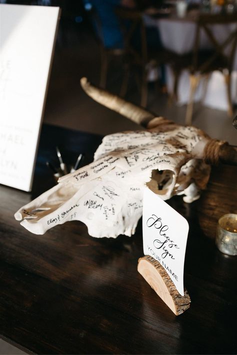 Cow skull wedding guest book with signatures for their boho southern wedding in Austin Texas Wedding For Hunters, Boho Guest Book Ideas For Wedding, Different Wedding Guest Book Ideas, Cowboy Hat Guest Book, Wedding Ideas Guest Book, Cow Wedding Decor, Western Grunge Wedding, Boho Wedding Ideas Decoration, Cow Themed Wedding Ideas