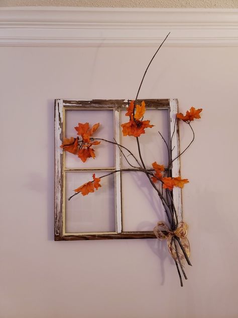 An old window with wavy glass and faded white paint, long branches attached to corner, autumn ribbon to tie the branches together, and fake orange and red leaves make for the perfect fall decor! Fall Decor With Old Windows, Decor With Old Windows, Fake Window Decor, Old Window Decor, Fake Leaves, Fall Windows, Fake Window, Old Windows, Fall Time