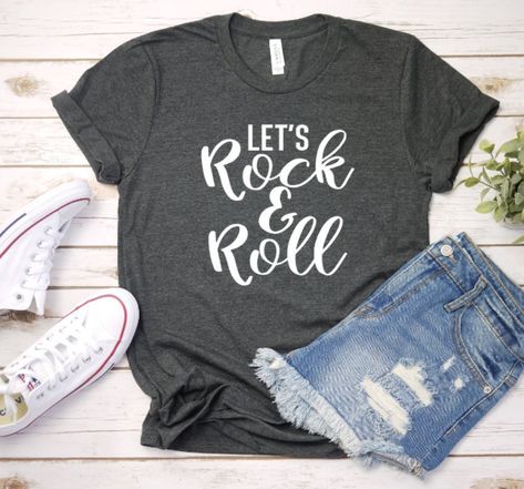 Let's Rock & Roll Tee. Listing is made using Bella Canvas brand unisex tees in heather colors This tee is 52% cotton and 48% polyester and is super soft. Sizes available in this tee are S-2X. image is applied using heat transfer vinyl. I will include care instructions in the package. Since this item is handmade please allow extra time for shipping.This is my original design and others that are sold elsewhere are not made by me and I cannot guarantee the quality if purchased elsewhere. Book Shirt, Glitter Shirt, Vegan Shirt, Festival Shirts, Hiking Shirts, Womens Shirt, Nursing Tshirts, Adulting Shirts, Travel Shirts