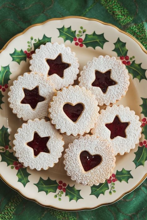 Discover Linzer cookies with raspberry jam: a classic holiday treat with scalloped edges and sweet, tart filling. Xmas Bucket List, Cookies With Raspberry Jam, Linzer Tart Cookies, Raspberry Linzer Cookies, Hat Cupcakes, 24 Days Of Christmas, Christmas Cookie Boxes, Cookies To Bake, Baked Goods Desserts