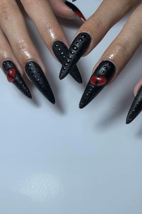 Unleash the mystique with a black nail set by @streetnail.art featuring a mesmerizing 3D red dragon’s eye, coupled with intricate dragon skin texture, for a captivating and fierce manicure. Craving a nail makeover? Your journey begins at nailustrous.com! Dive into our article for a wealth of captivating nail art ideas and transform your nails into works of art! Black Dragon Nails, Red Dragon Nails, Dragon Skin Texture, Nail Makeover, Dragon Nails, 3d Nail Designs, Dragon Skin, Black Nail, Press Ons