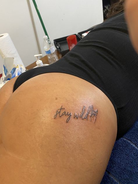 Keep It Wild Tattoo, Underneath Buttcheek Tattoo, Stay Wild Buttcheek Tattoo, Thigh Front Tattoos Women, Stay Wild Tattoo Ideas, Small Tattoos On Buttocks For Women, Stay Wild Tattoos For Women, Under Buttocks Tattoo Women, Stay Wild Tattoo Buttcheek