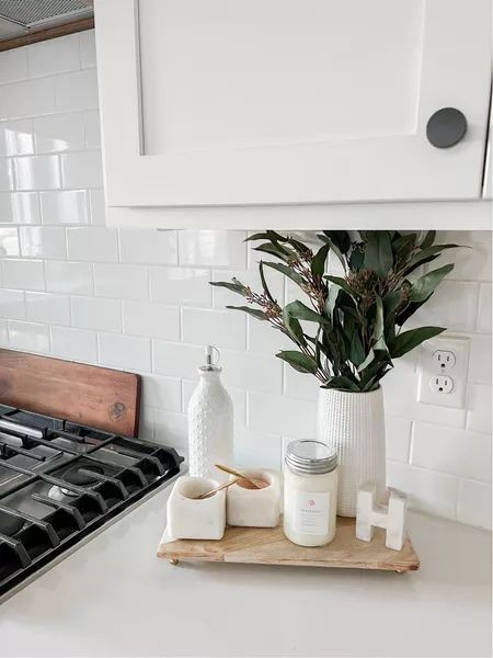 Simple yet chic white marable salt and pepper bowls with a wooden kitchen counter tray that sits perfectly with a candle and some addiontal pieces to bring it to life. #marblesaltandpepperbowls #homedecor #kitcheninspo Wooden Tray For Kitchen Counter, Wooden Tray Kitchen Counter, Salt And Pepper Kitchen Counter, Kitchen Salt And Pepper Tray, Salt And Pepper Decor, Diy Dining Table Centerpiece, Wooden Kitchen Counter, Salt And Pepper Bowls, Kitchen Counter Tray