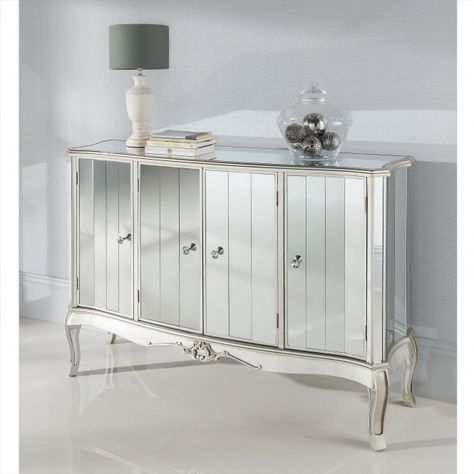 This marvelous mirrored sideboard from our collection of Argente glass furniture adds a lovely charm to your bedroom. Sure to brighten up your home in an instant, this stunning Venetian 4 door sideboard finished off with a antique silver trim is sure to impress across generations. Height: 92cm Width: 136cm Depth: 40cm Antique Silver Paint, French Style Mirrors, Unique Sideboard, Mirrored Sideboard, Solid Wood Sideboard, Side Board, Large Sideboard, Silver Decor, Glass Furniture