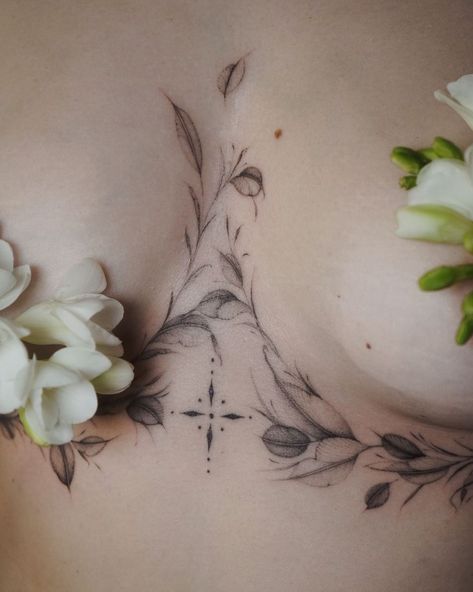 sensual and feminine tattoos Cool Spinal Tattoo, Large Delicate Tattoo, Women’s Under Breast Tattoos, Sternum Vine Tattoo Women, Sternum Piece Tattoo, Floral Underbust Tattoo, Flower Tattoos Sternum, Botanical Tattoo Women, Underbust Tattoos For Women