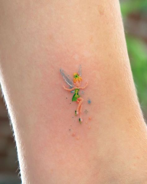 OVENLEE 🍃 ChaeheeLee on Instagram: "Teeny tiny tinkerbell ✨  #tinkerbelltattoo #tinkerbell #cutetattoo #minitattoo #tattoooftheday #smalltattoosforgirls #latattooartist" Tiny Disney Tattoo, Tinkerbell Tattoo, Matching Tattoos For Couples, Tinker Bell Tattoo, Carnation Tattoo, Tattoos For Couples, Unique Small Tattoo, Turtle Tattoo Designs, Ear Tattoo Ideas