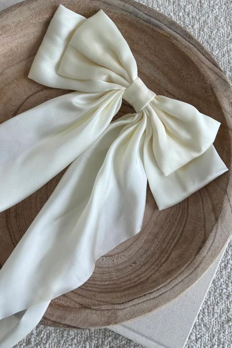 COLOR: Cream As the newest addition to the SB bow collection, the luxe silk bow does not disappoint. This oversized bow elevates and adds a pop to any holiday outfit. DETAILS + CARE: Material: Satin Size: 8.9(L) x 12.6(H) inches Tight, clasping barrette closure Designed with love in San Diego Coquette Stuff, Monica Murphy, Bow Outfit, Girly Vibes, Butterfly Photography, Hair Tie Accessories, Product Shoot, Kawaii Shoes, Classy Girl