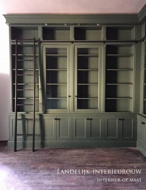 Office Built Ins With Glass Doors, Bedroom With Bookcase Wall, Bookshelves With Vaulted Ceiling, Retail Feature Wall Design, Rooms With Grand Pianos, Corner Bookshelves With Storage, Home Library Ideas Vintage, Masculine Lighting, Moody Home Library