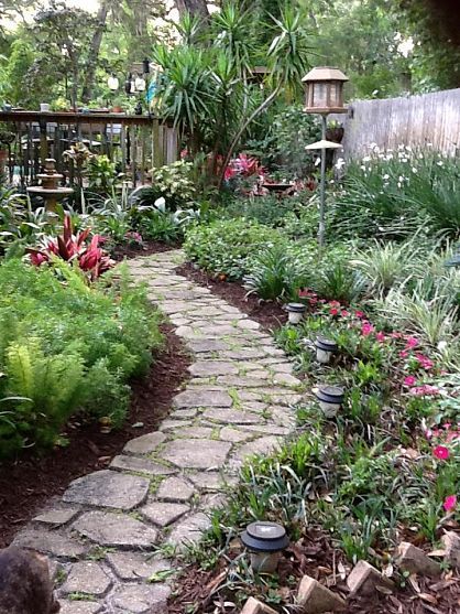 YARD – great design! A garden walkway with a mold that we purchased at Lowe's. We mixed the Quickcrete up and then poured it into the mold a section at a time. It was almost like making mud pies. It was a bit time consuming but we were very happy with the end result. It has held up very well as it has been down now for about 3 years. Walkways Paths, Garden Walkway, Portland Cement, Concrete Garden, The Secret Garden, Peat Moss, Garden Path, Garden Pathway, Plants And Flowers