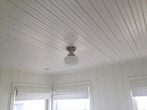 White painted beadboard ceiling and shiplap walls - all white Wood Ceiling Diy, Beadboard Walls And Ceiling, Pvc Beadboard, Lakehouse Lighting, Painted Beadboard, Wood Walls Bedroom, Ceiling Diy, Light Wood Bed, High Ceiling Lighting