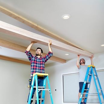 How to Build Beautiful Faux Ceiling Beams (DIY) | Family Handyman Studio Mcgee Beams, Black Beams Bedroom, Building Faux Wood Beams, Wall Opening Between Rooms Wood Beams, Light Colored Ceiling Beams, English Cottage Ceiling Beams, How To Install Faux Ceiling Beams, Adding Ceiling Beams, Light Wood Beams On Ceiling Living Rooms