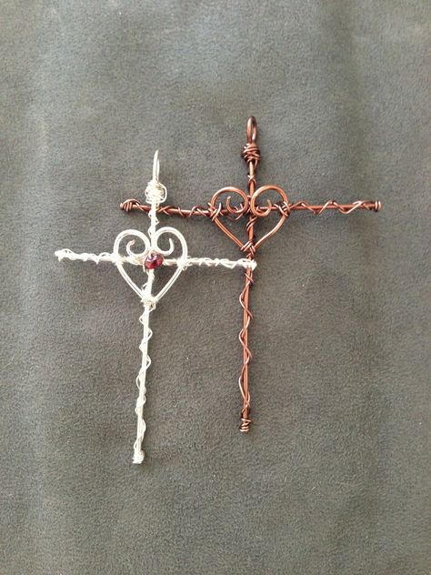 Wire Wrapped Heart/Cross pendants: one is all copper wire and the other is silver plated wire with a small garnet bead. Wire Wrapped Heart, Wire Jewelery, Wire Wrap Jewelry Designs, Wire Diy, Cross Crafts, Wire Jewelry Designs, Beaded Cross, Diy Wire Jewelry, Wire Work Jewelry