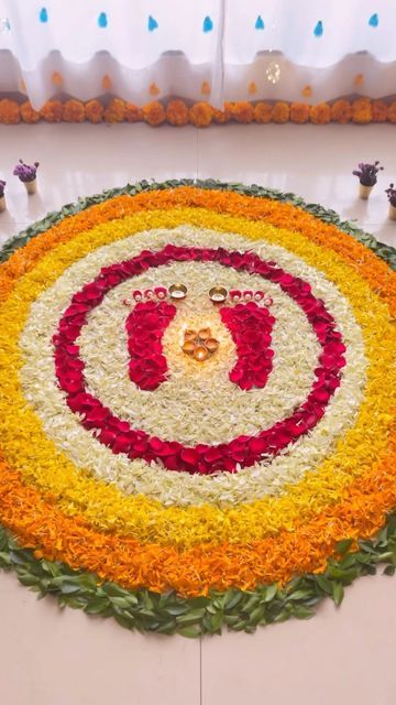 Laxmi Pooja Rangoli Designs Diwali, Lakshmi Feet Rangoli, Flower Petal Rangoli Designs, Rangoli With Flowers Petals For Diwali, Easy Laxmi Rangoli, Marigold Rangoli Design, Rangoli For House Warming Ceremony, Rangoli With Flowers Petals Easy, Rose Flower Rangoli