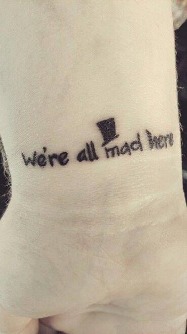 Alice in Wonderland "We're all mad here" tattoo Alice In Wonderland Finger Tattoo, Matching Alice In Wonderland Tattoos, Tiny Alice In Wonderland Tattoo, We Are All Mad Here Tattoo, Were All Mad Here Tattoo, Simple Alice In Wonderland Tattoo, All Mad Here Tattoo, We're All Mad Here Tattoo, Group Tattoo Ideas